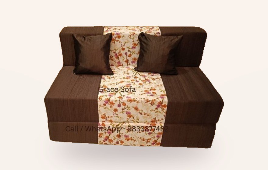 Brown sofa cum bed with floral centre panel