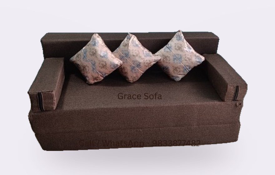 Brown sofa cum bed with cream cushions