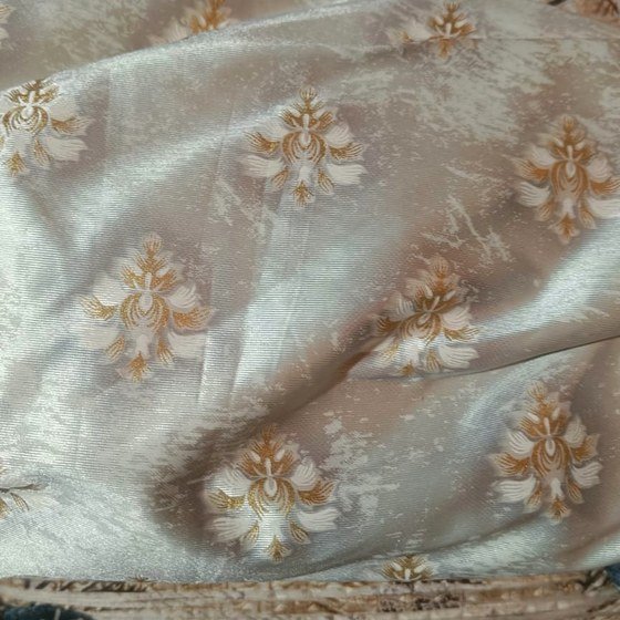 Cream and gold brocade upholstery fabric